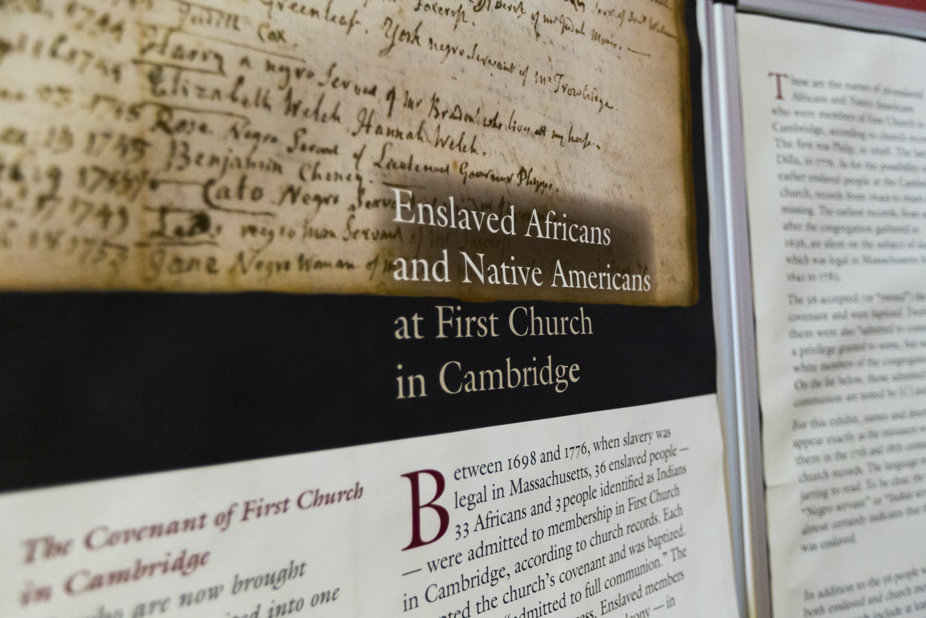 An wall panel detailing the history of Enslaved Africans and Native Americans at First Church in Cambridge