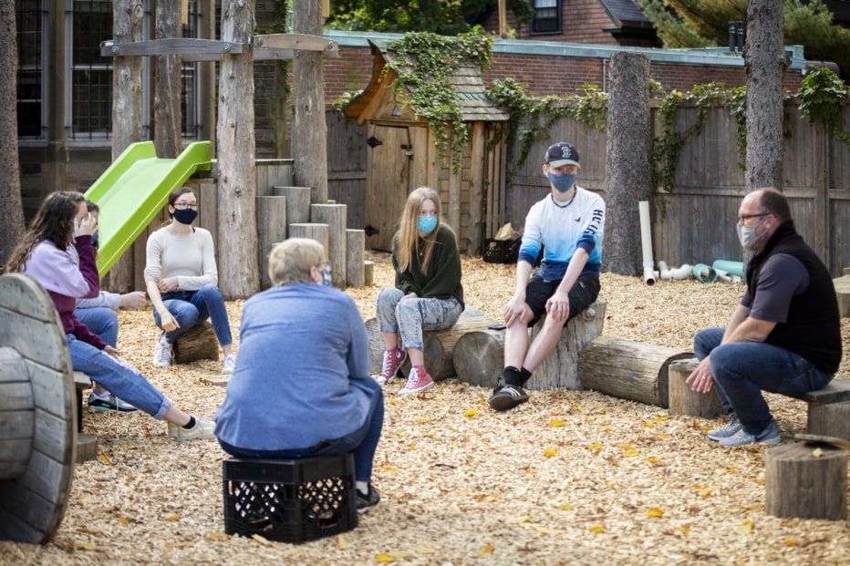 young people sitting in a circle