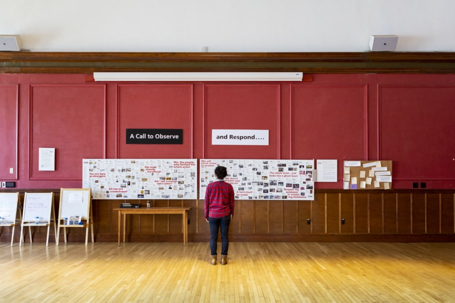 girl standing in front of an exhibit