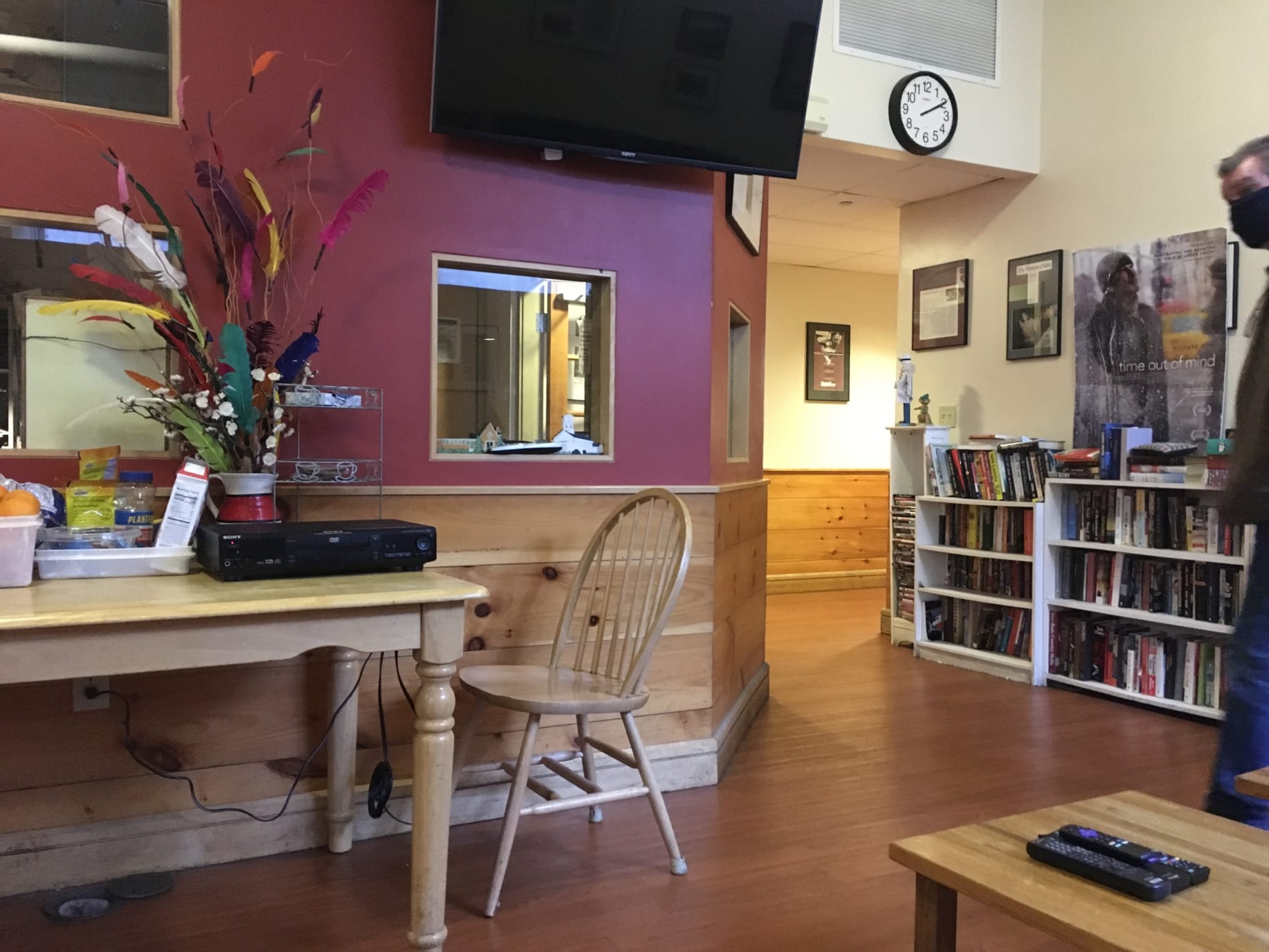 inside a room with a bookcase and chair